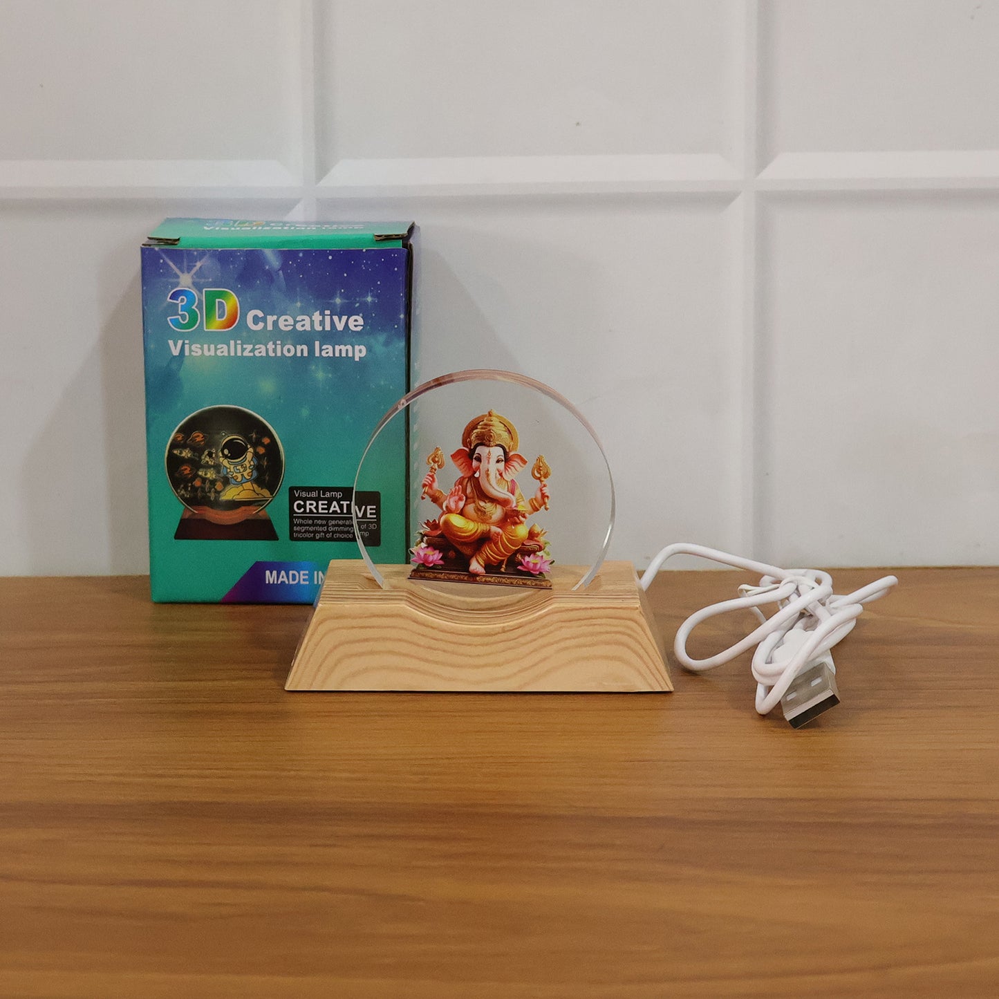 Premium 3D Lord Ganesha acrylic LED night lamp by Wukusy, showcasing a detailed Ganesha figure illuminated with soft LED light.