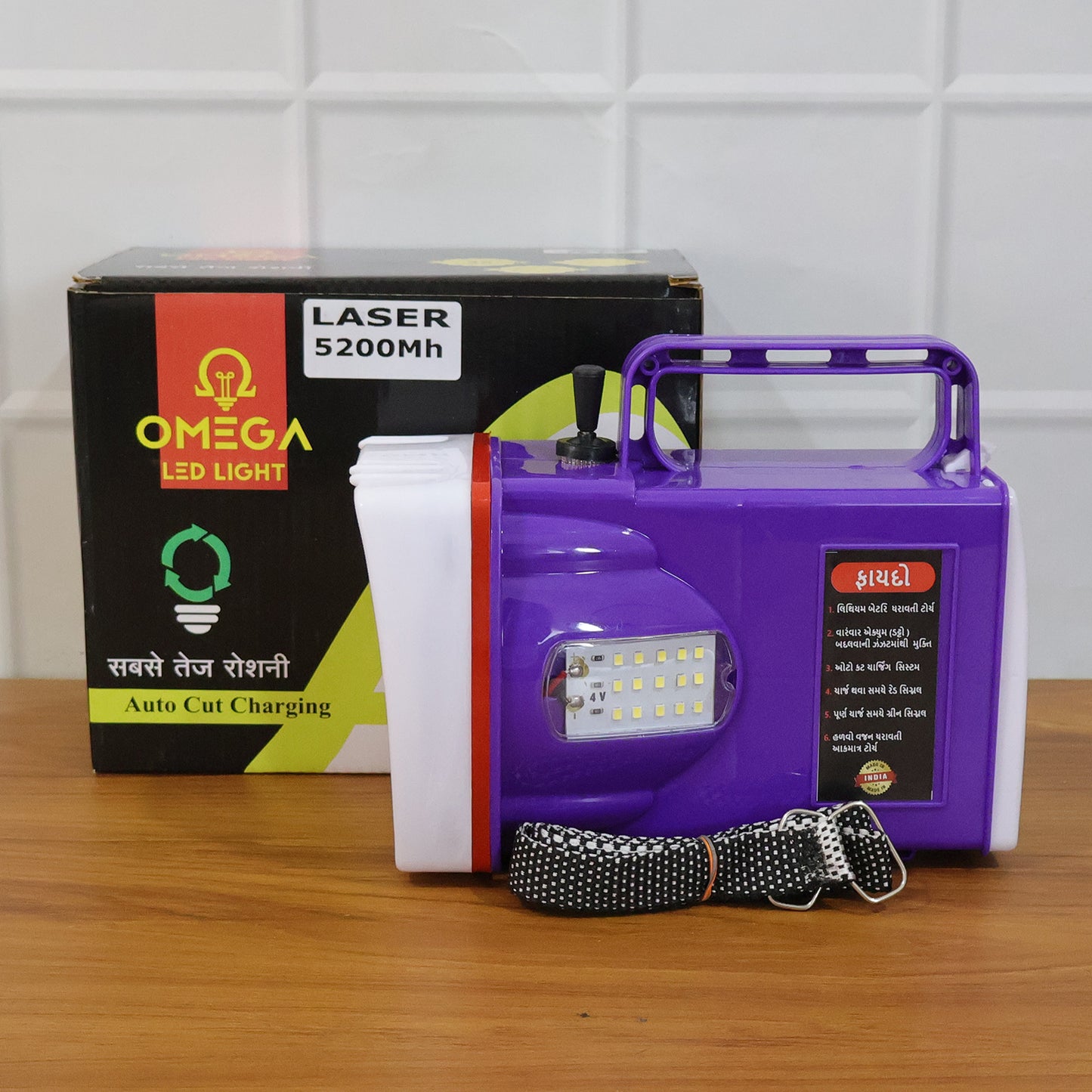 Wukusy Omega rechargeable LED laser torch light with 5200mAh battery, black handheld flashlight illuminating a dark area.