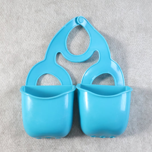 Wukusy double layer sink hanging storage basket for kitchen organization, featuring two mesh compartments for utensils and cleaning supplies.