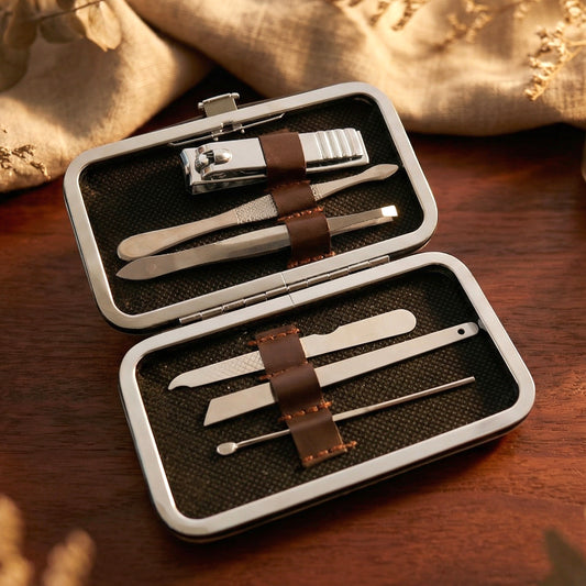 Wukusy 6-in-1 premium nail care kit with manicure and pedicure tools arranged in a portable grooming set.