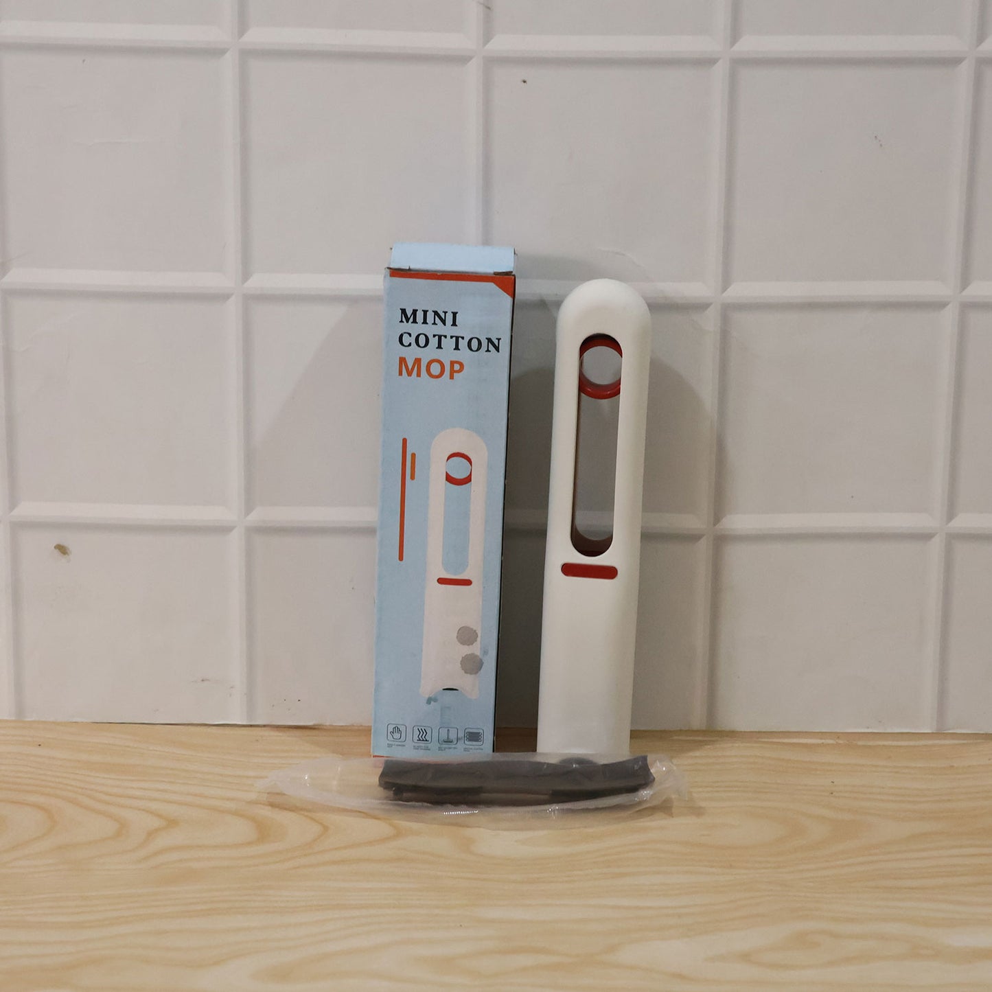 Wukusy handheld mini cotton mop for cleaning desks and glass surfaces, featuring self-squeeze portable design.