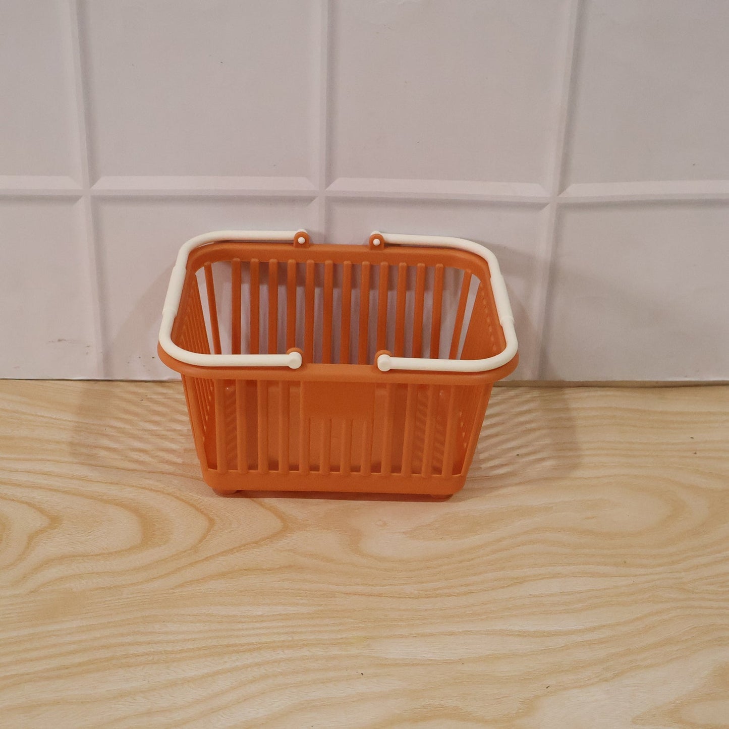 Wukusy plastic storage basket with foldable handles for fruits, vegetables, and groceries, showing the basket filled with produce.