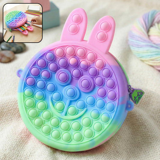 Cute caterpillar-shaped silicone pencil pouch by Wukusy with colorful pop it bubble design for kids' stationery storage.