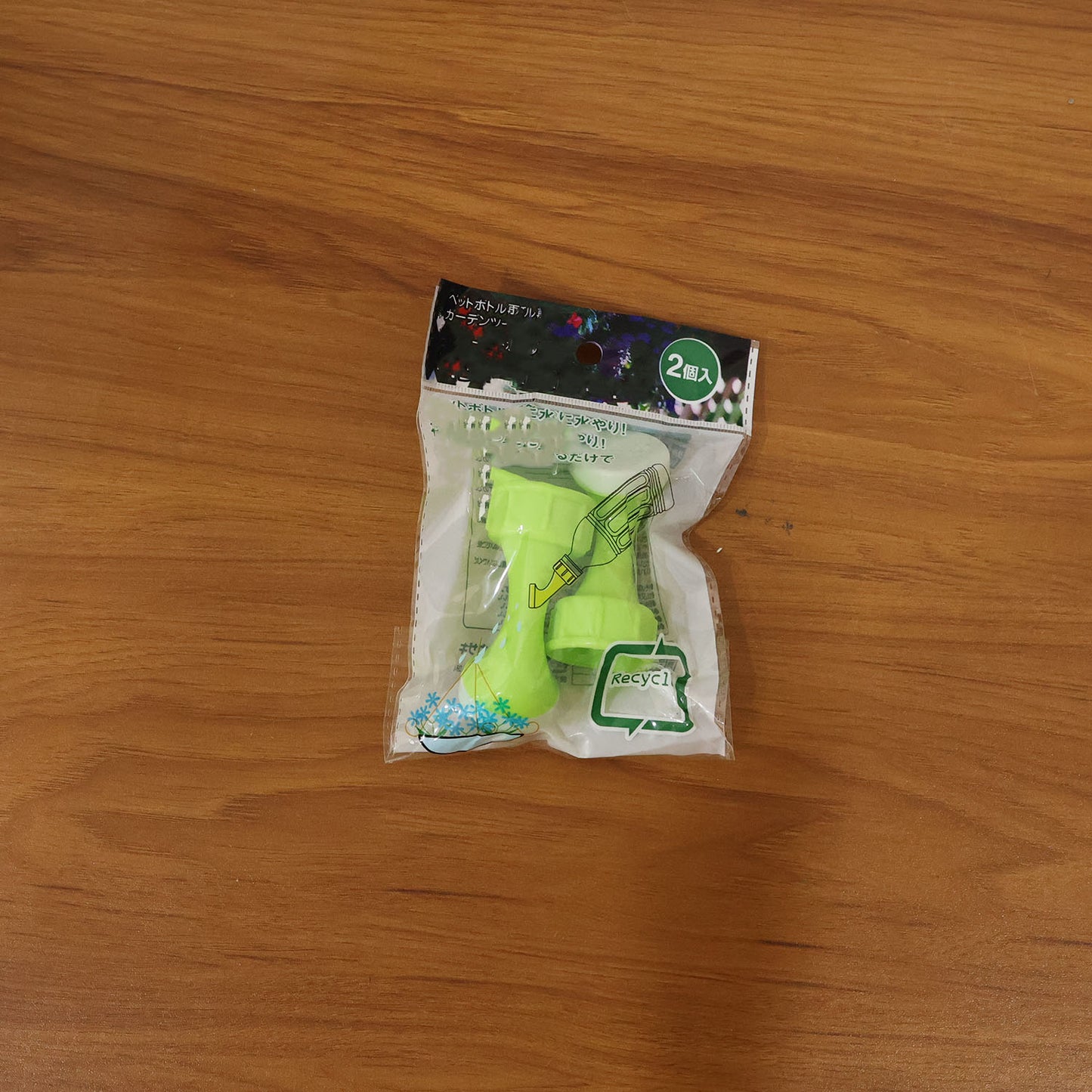 Wukusy garden water sprinkler head with two bottle watering nozzles for precise plant watering and garden irrigation.