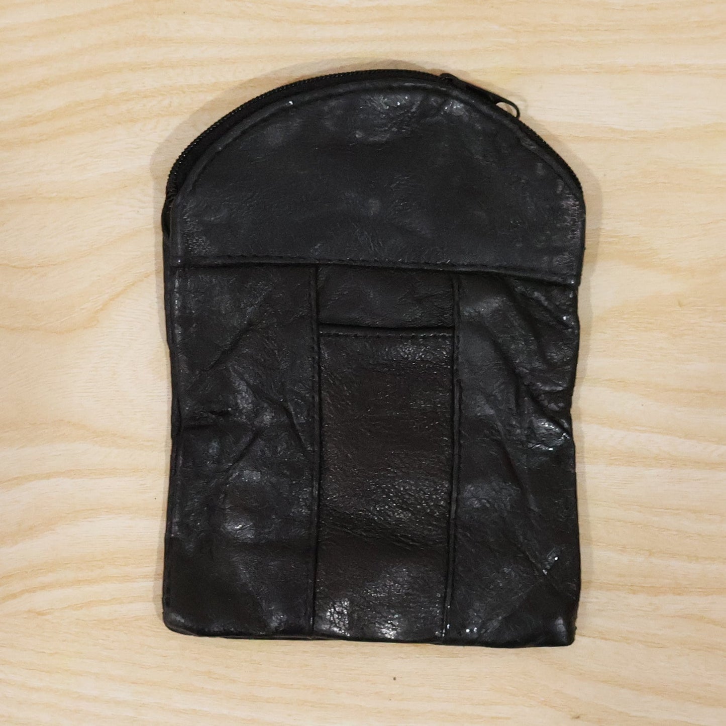 Leather mini zipper pouch by Wukusy, compact coin and card organizer for men and women, with a sleek, stylish design.