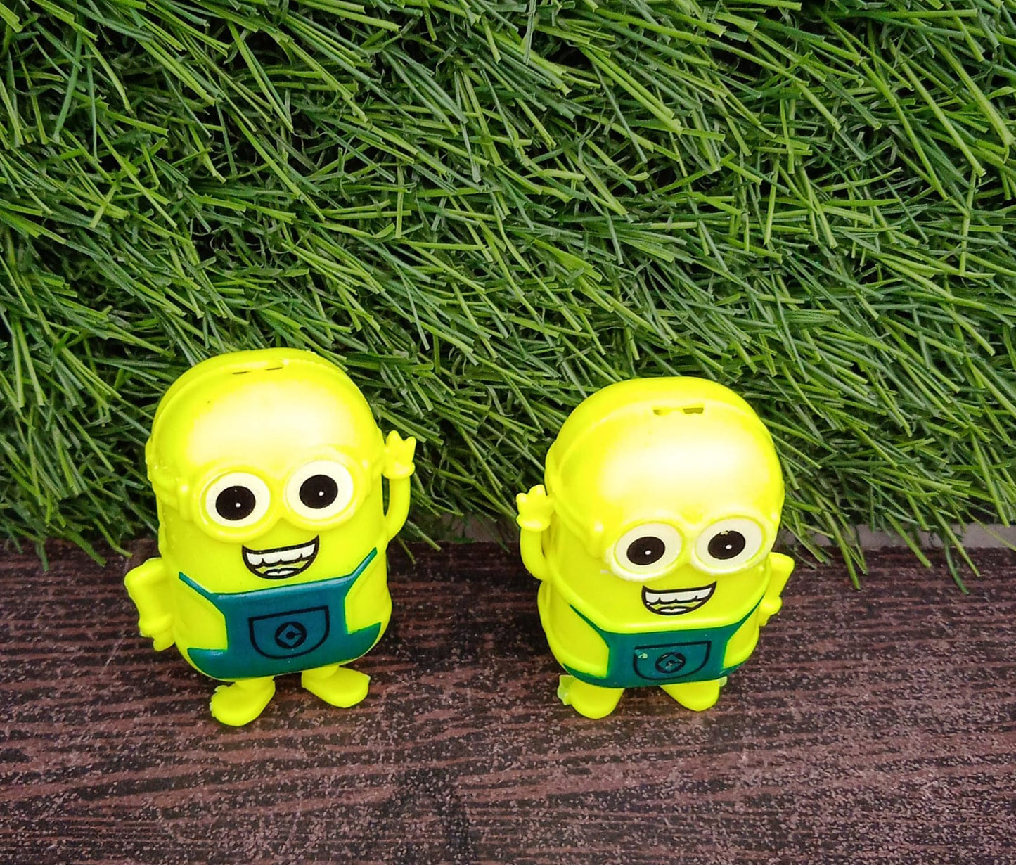 Small green Wukusy Minion toy for kids, featuring a cute, small-sized Minion character from the toy collection.