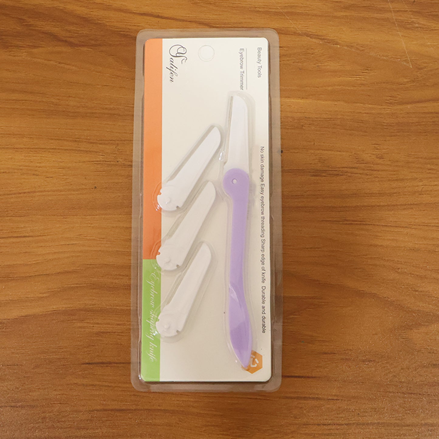 Wukusy eyebrow facial hair razor with three replaceable blades, shown with a close-up of the razor and blades.