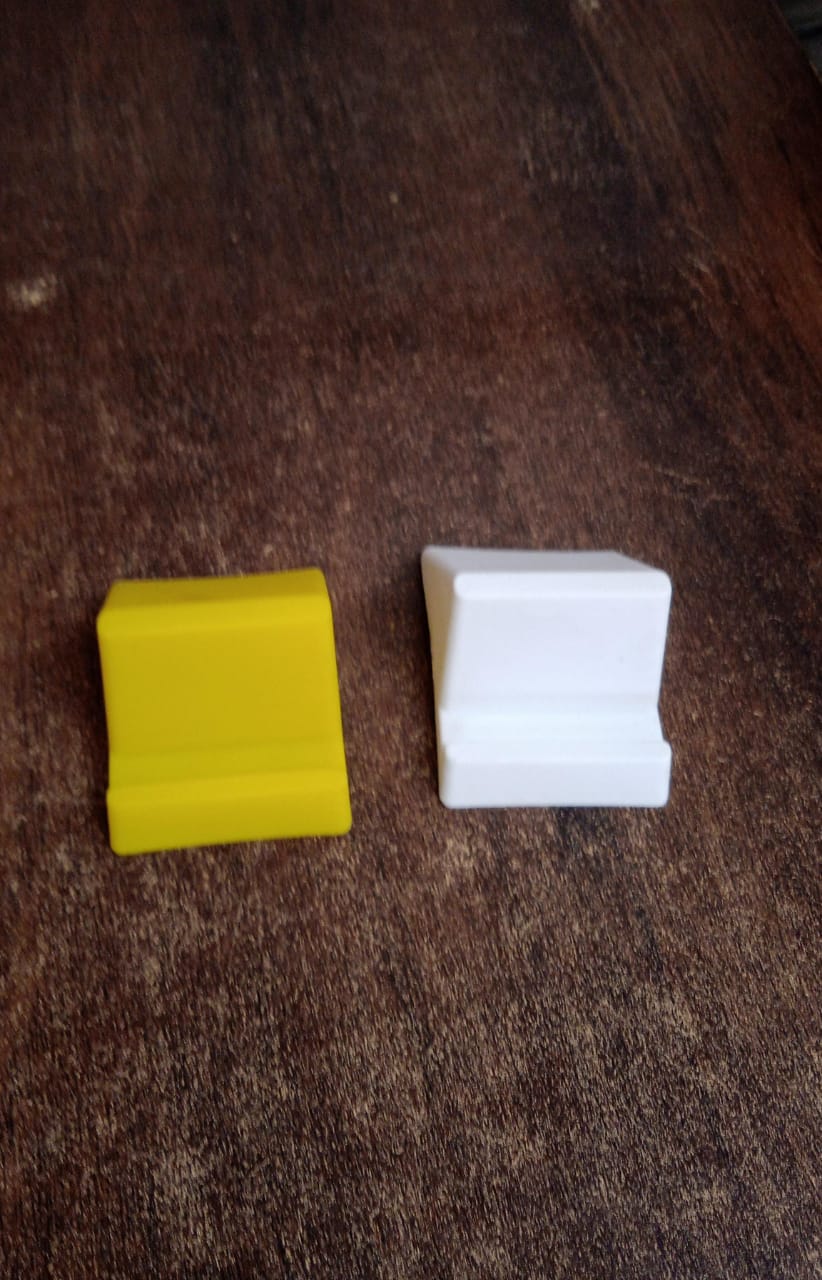 Compact plastic Wukusy mobile phone holder stand in mixed colors, lightweight and portable for hands-free device use.