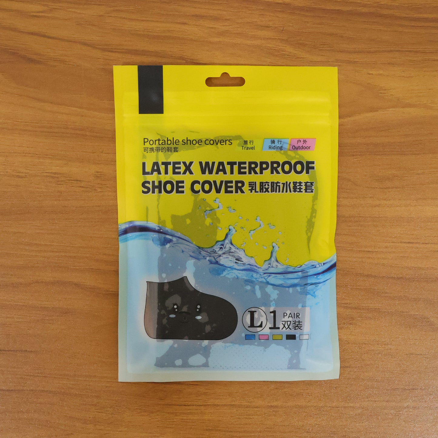 Pair of large waterproof silicone shoe covers by Wukusy, designed to keep footwear dry in wet conditions.