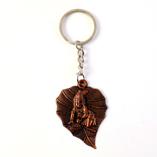 Antique-finish metal keychain from Wukusy with intricate design, attached to a keyring, showcasing a vintage-style accessory.