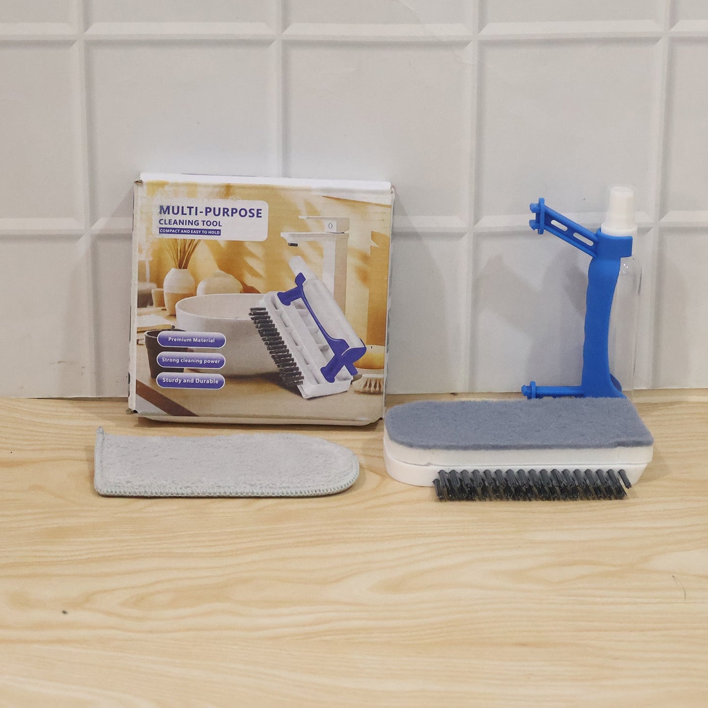 Wukusy 3-in-1 multi-purpose cleaning brush with soap dispenser, sponge, and scrubber for kitchen and household cleaning.