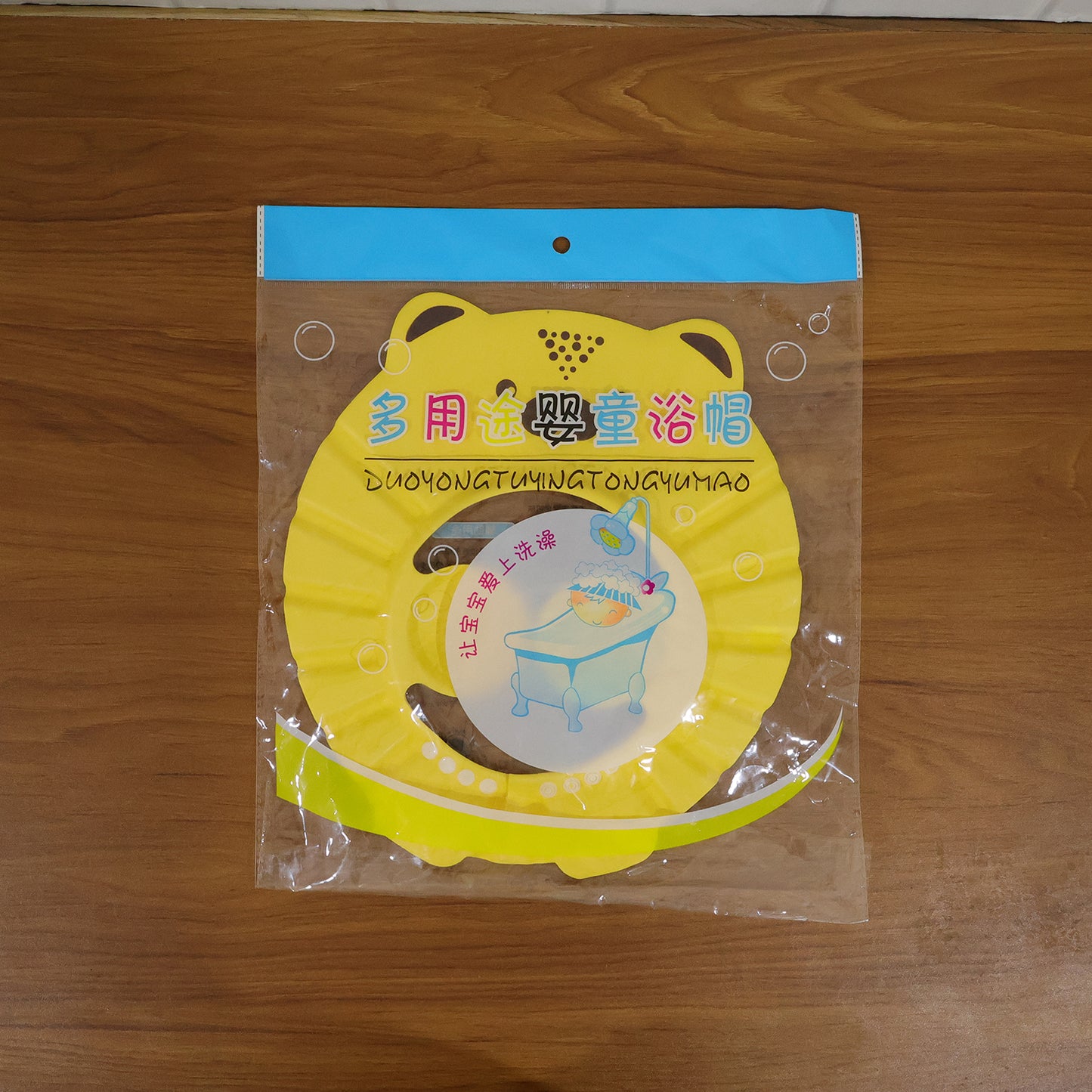 Wukusy cute cartoon baby shower cap shampoo bath hat, waterproof silicone design, with colorful cartoon pattern for infants.