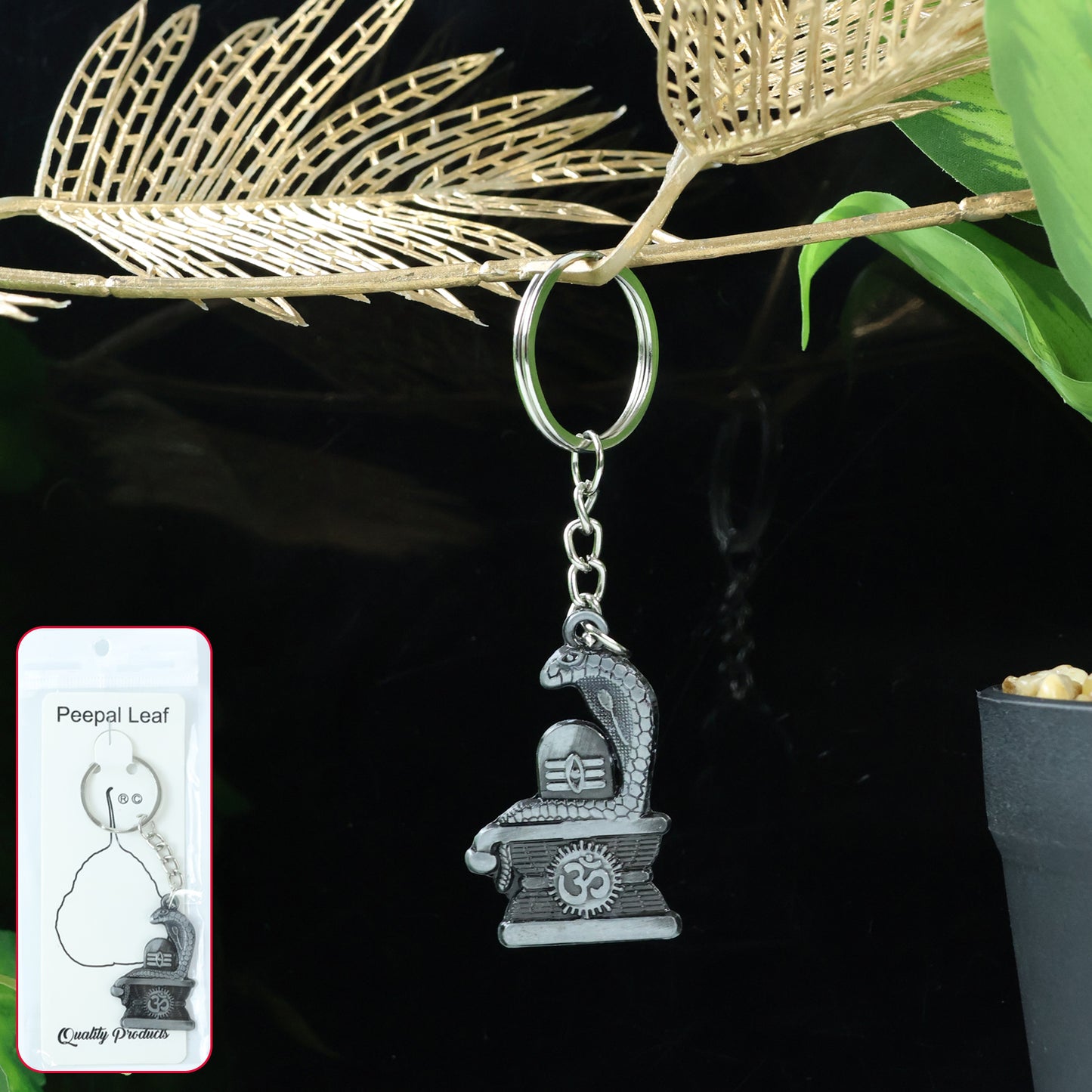 Silver Shivling with snake design keychain from Wukusy, featuring intricate craftsmanship and detailed snake motif.