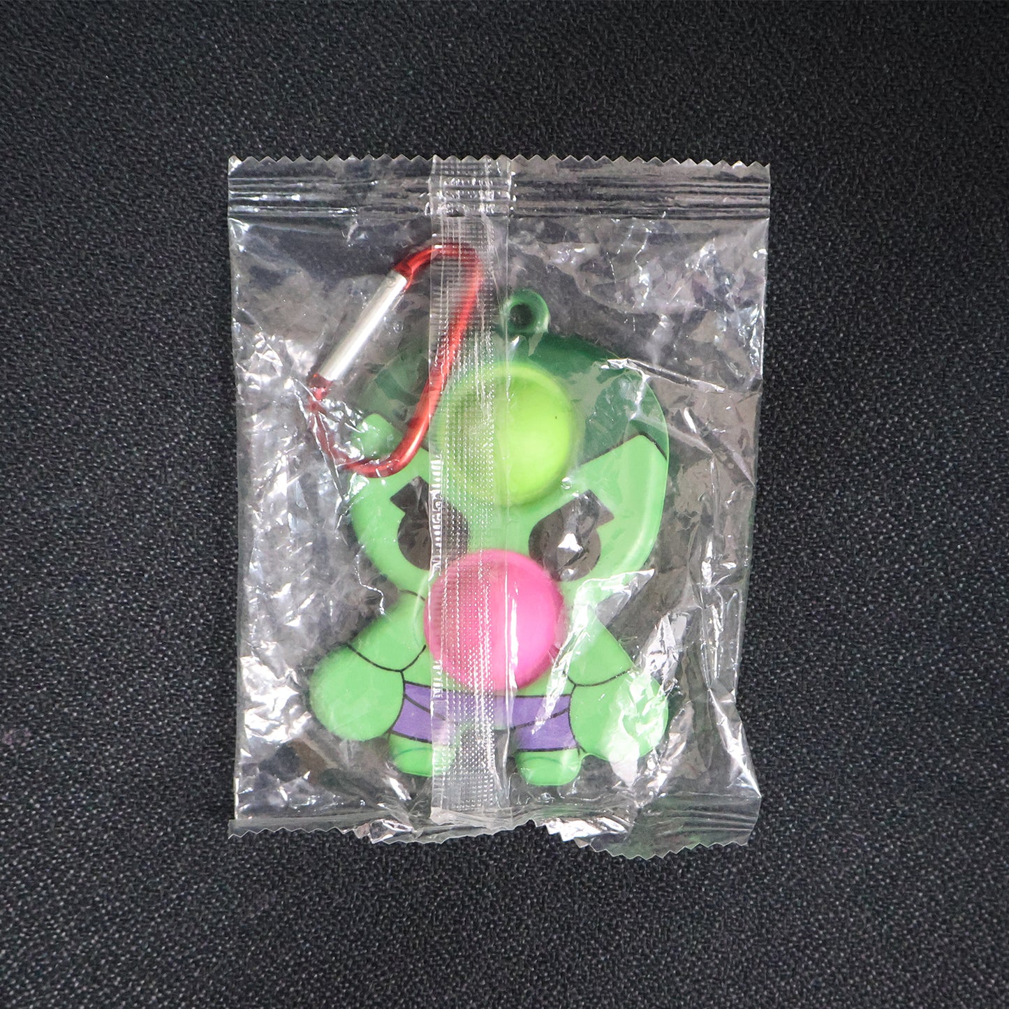 Wukusy silicone Pop It fidget toy with keychain clip, colorful bubble sensory toy for stress relief and tactile fun.