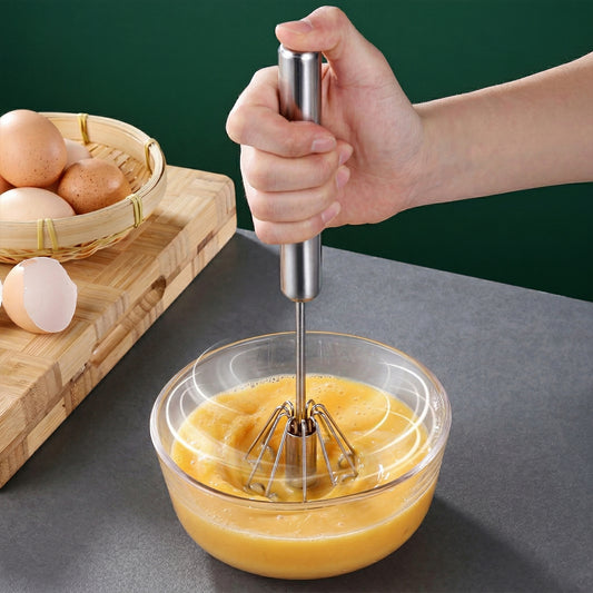 Wukusy stainless steel hand push rotary whisk with 29 cm handle for mixing and whisking in the kitchen.
