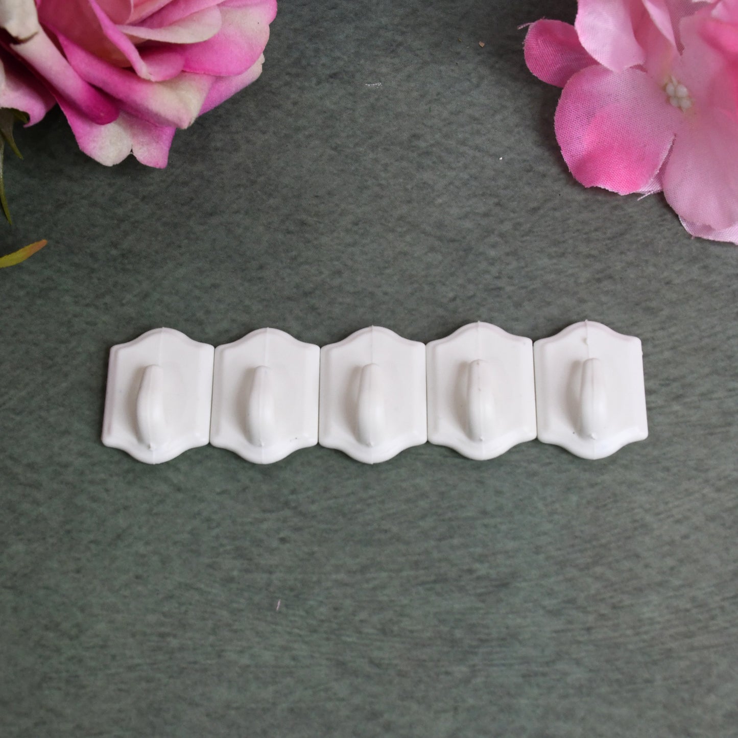 Set of 10 small adhesive hooks for wall hanging by Wukusy, ideal for home and kitchen organization.