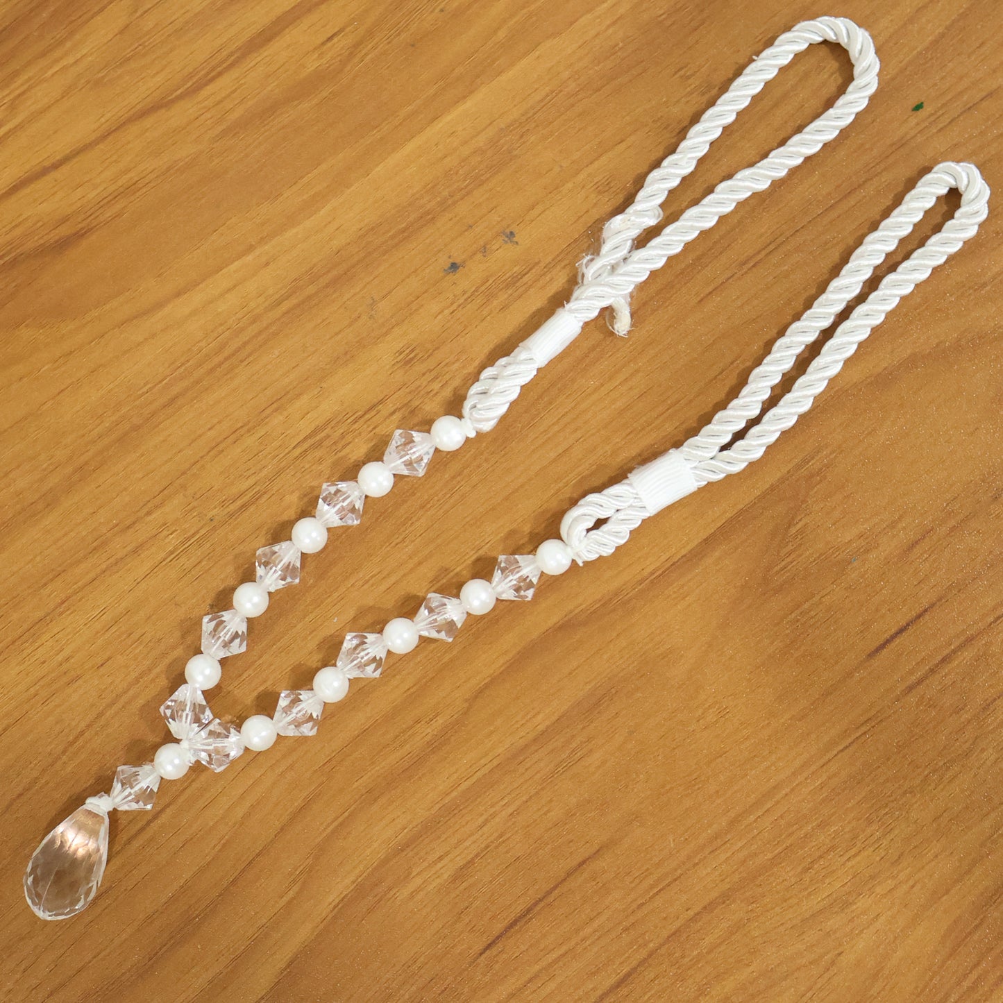Luxury crystal and pearl beaded curtain tieback by Wukusy, featuring elegant crystal and pearl beads for decorative window accents.