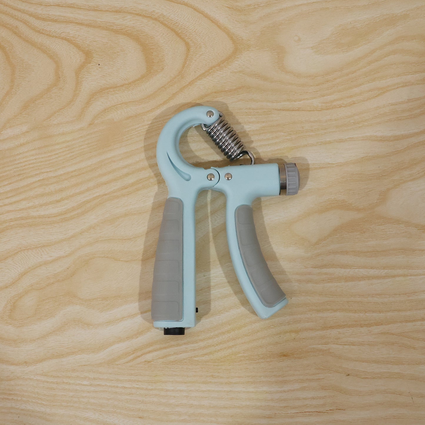 Wukusy adjustable hand grip strengthener for forearm exercise, showing black grip handles and tension adjustment mechanism.