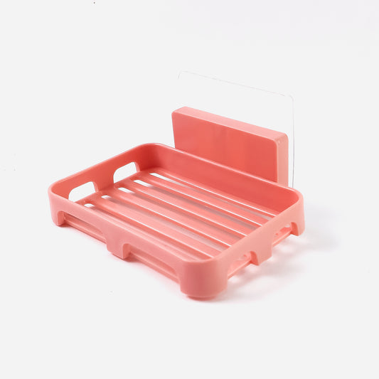 Wukusy self-adhesive rectangular soap dish holder mounted on bathroom wall, made of durable plastic for convenient soap storage.