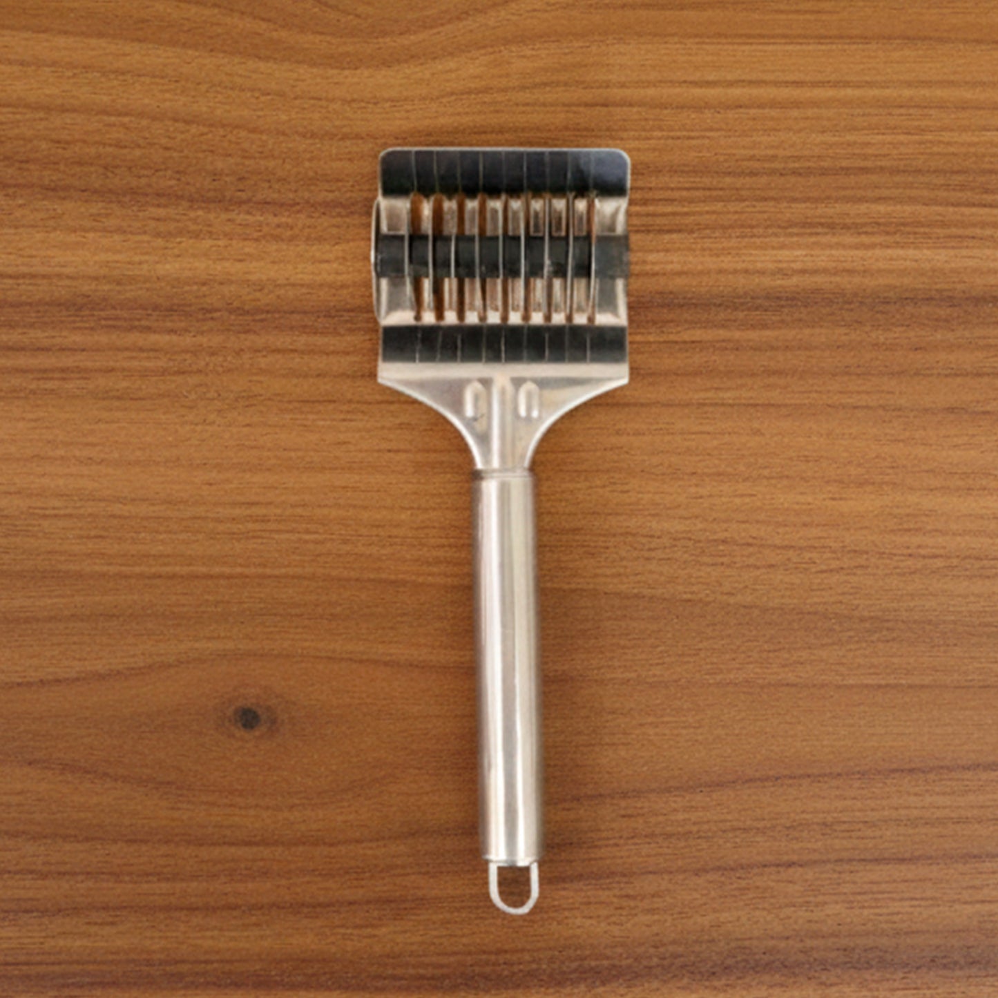 Wukusy manual multi-blade dough cutter roller with multiple blades for precise dough cutting, shown on a clean surface.