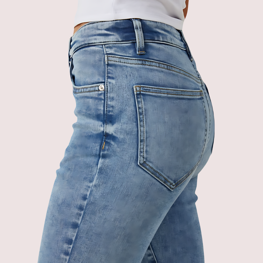 Women's high waist skinny jeans by Snazzyway with a perfect curve fit, shown in dark denim with front pockets and belt loops.