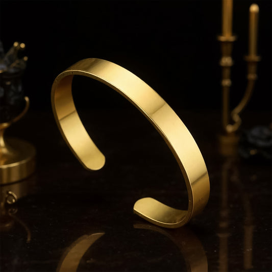 Elegant gold finish open cuff bracelet by Wukusy featuring a sleek, stylish design for fashion accessories.