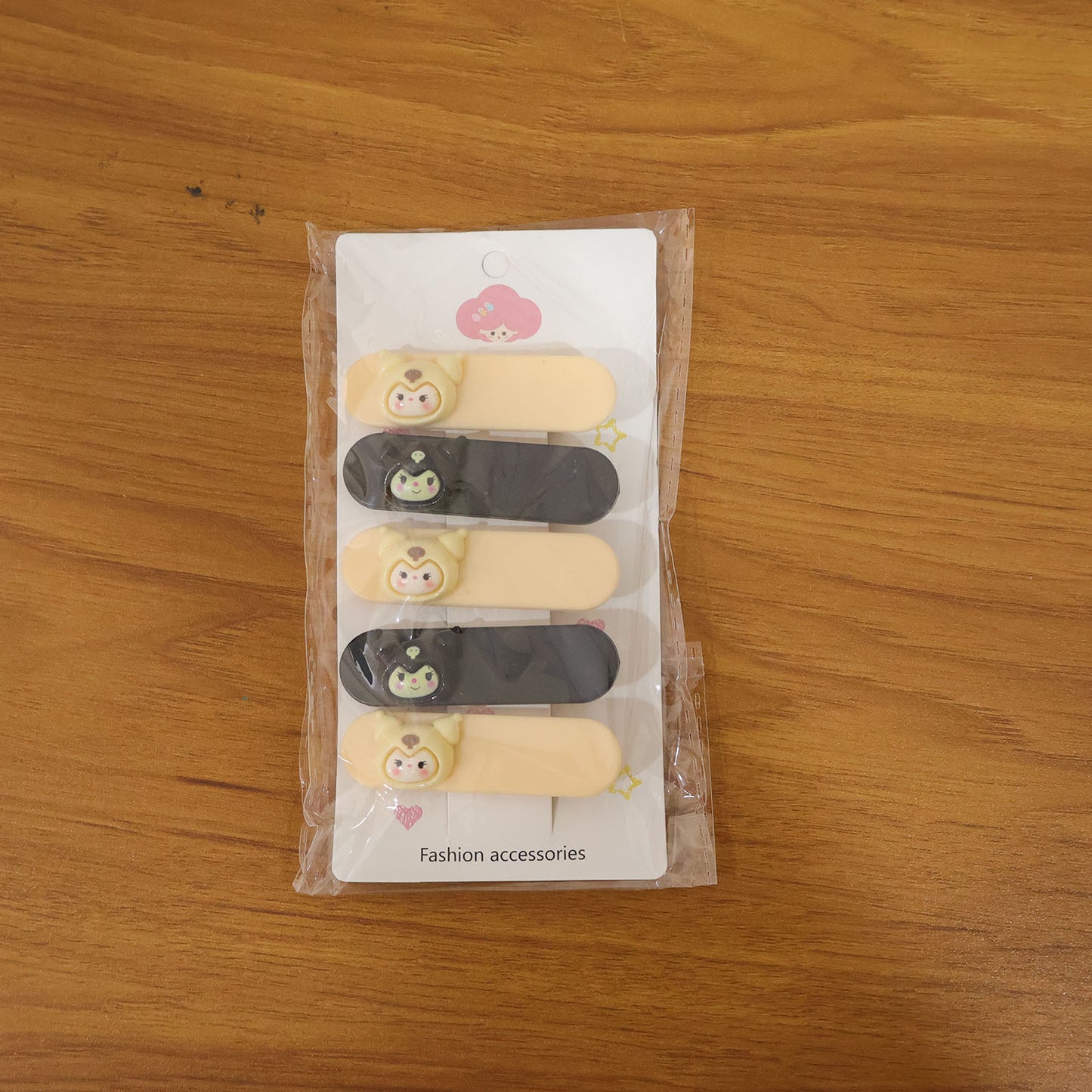 Set of five cute cartoon character hair clips by Wukusy featuring colorful, playful designs for kids' hair accessories.