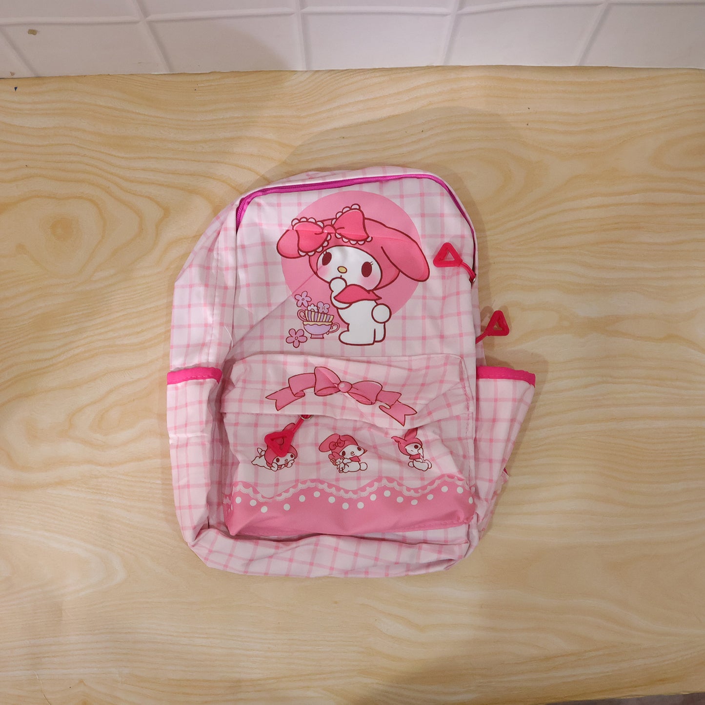 Wukusy 13-inch backpack featuring a cute bow and bunny design, perfect for children or casual use.