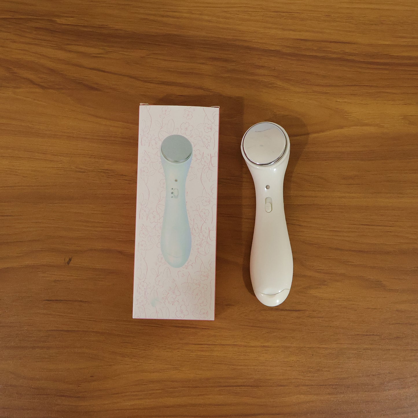 Wukusy portable facial massager device with sleek design, ideal for skincare and facial relaxation.