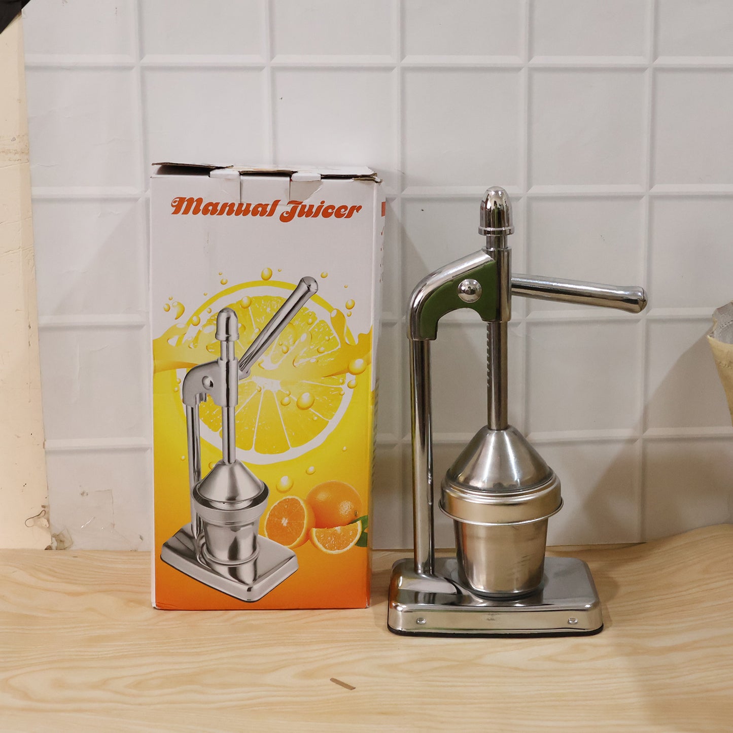 Wukusy heavy-duty manual citrus juicer hand press for lemons and oranges, featuring a sturdy metal construction and ergonomic handle.
