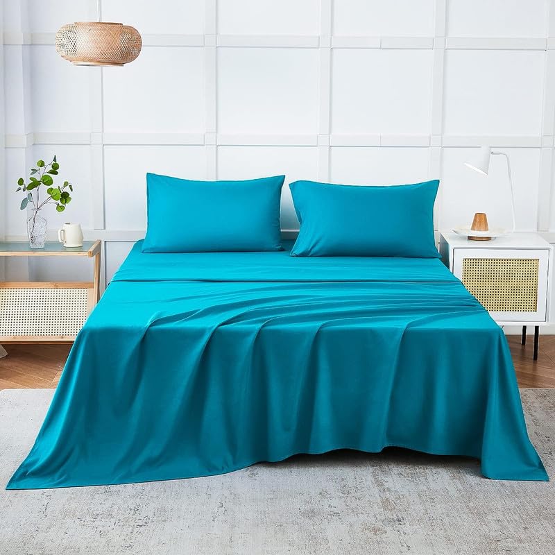 Teal double bed bedsheet from FIZZI SHOP with 90x100 inch size, featuring a soft, smooth fabric for comfortable sleep.