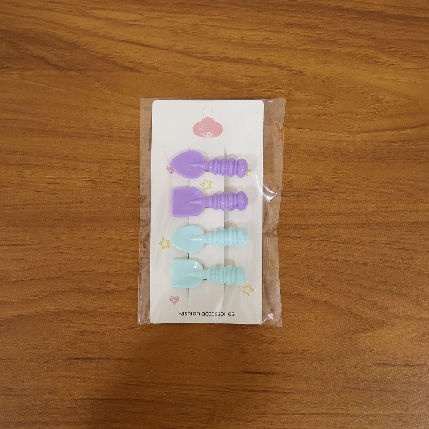Set of four Wukusy cute spoon and spatula-shaped decorative hair clips with colorful, playful designs for kids' hair accessories.
