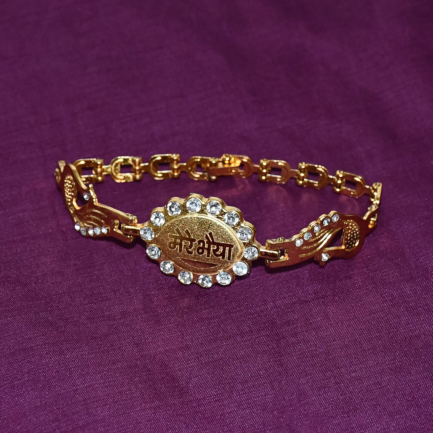 Wukusy bracelet with stone border and dual peacock chain end rakhi featuring intricate design and vibrant craftsmanship.