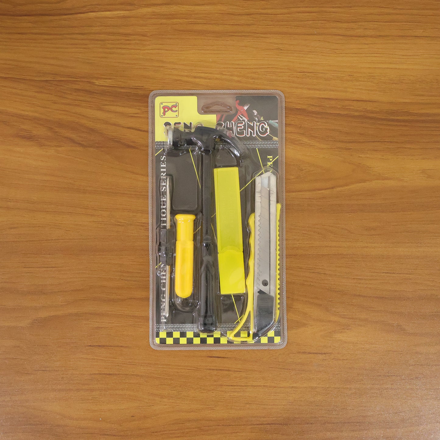 Wukusy mini hardware tool kit with hammer, screwdriver, and cutter set displayed with tools laid out on a surface.