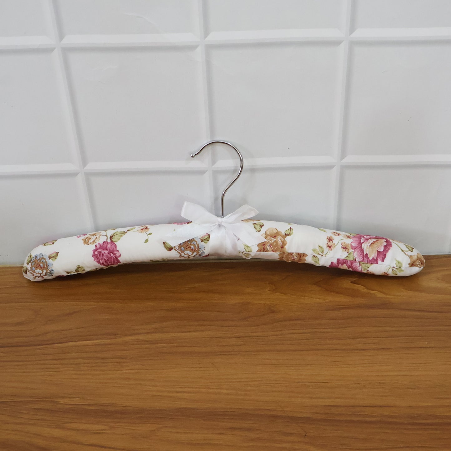 Wukusy premium padded floral clothes hanger with soft padding and floral design, ideal for delicate garments and closet organization.