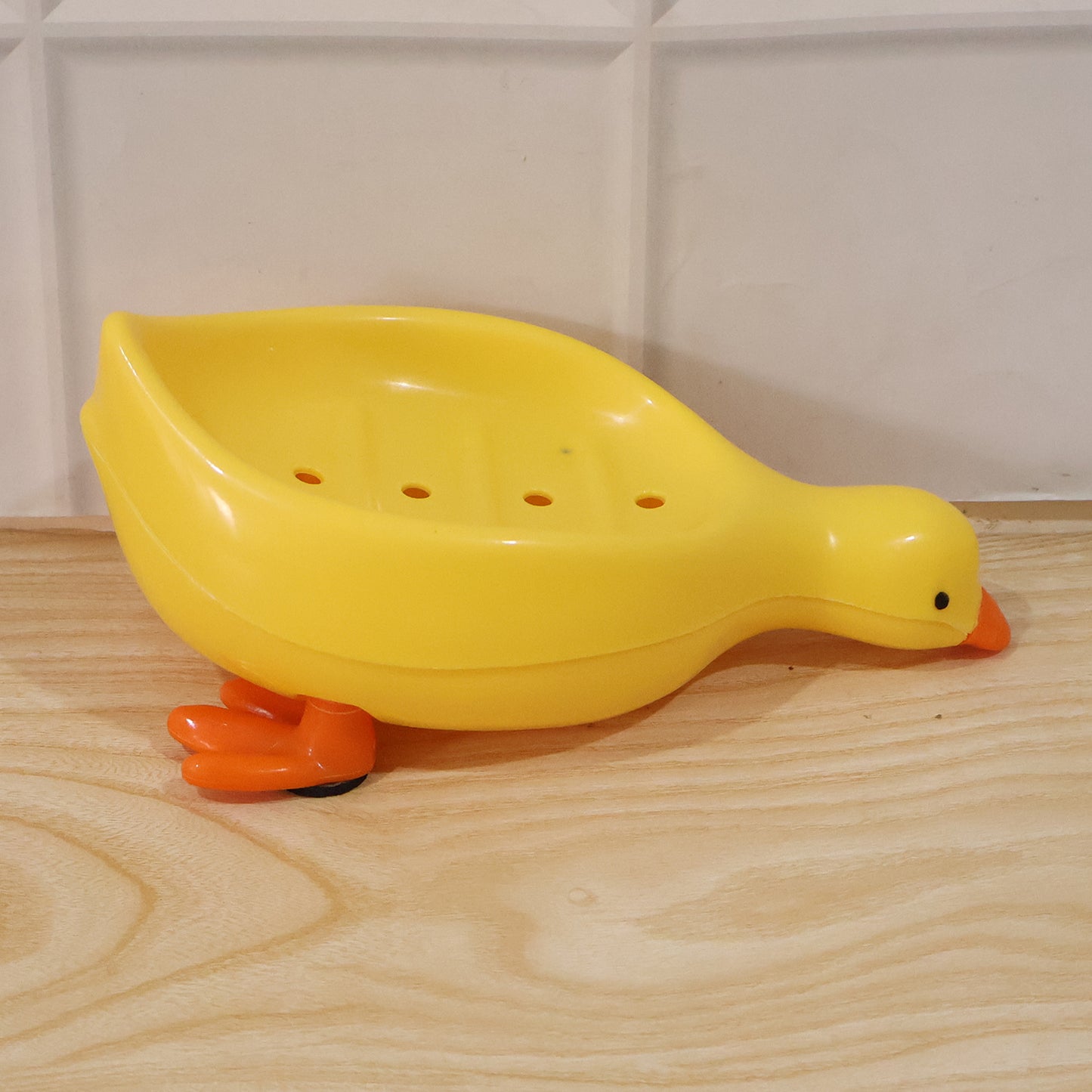 Cute duck-shaped plastic soap holder for bathroom, Wukusy kids soap dish tray with drainage slot, ideal for bathroom or kids' use.