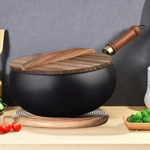 Artisan unenameled cast iron casserole from 25560, used for serving and cooking in a durable, rustic style.