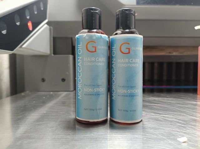 Pair of 18058 hair care conditioners in 100gm each, featuring smooth, creamy textures for nourishing hair care.