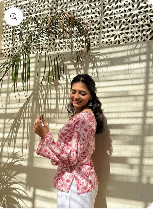 Pink and white printed sleeveless straight kurti for women and girls with square neck and flared design, by 13374.