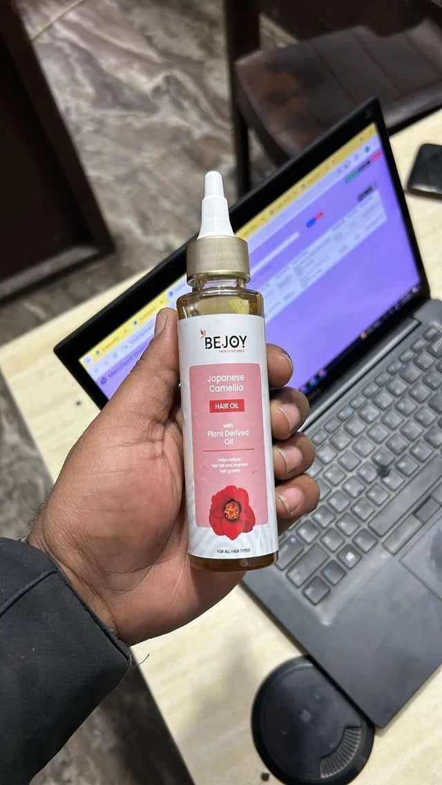 Bejoy Japanese Camellia Baby Hair Oil in 150 ml bottle, pack of 2, featuring a clear bottle with a screw cap and product label.
