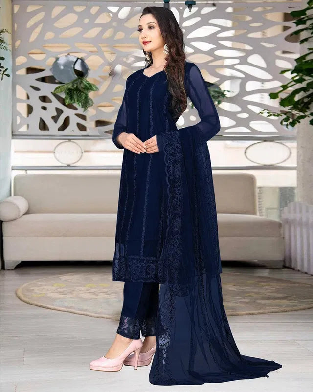 Elegant women's kurta set with matching dupatta and bottomwear from 15801, featuring intricate embroidery and vibrant fabric.