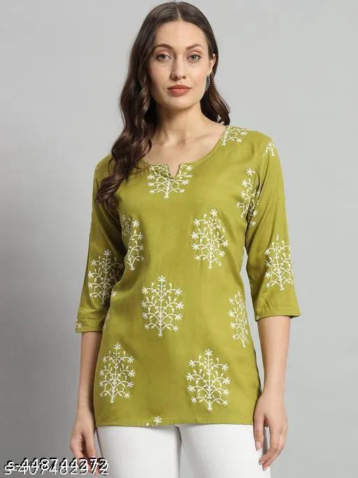Printed green rayon short kurti for girls and women, casual women's kurti with floral patterns and short sleeves.
