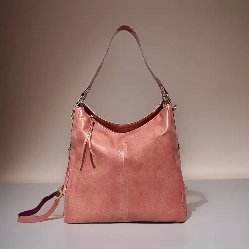 Black vegan leather shoulder bag for camping and hiking, spacious, water-resistant, lightweight with an adjustable strap.