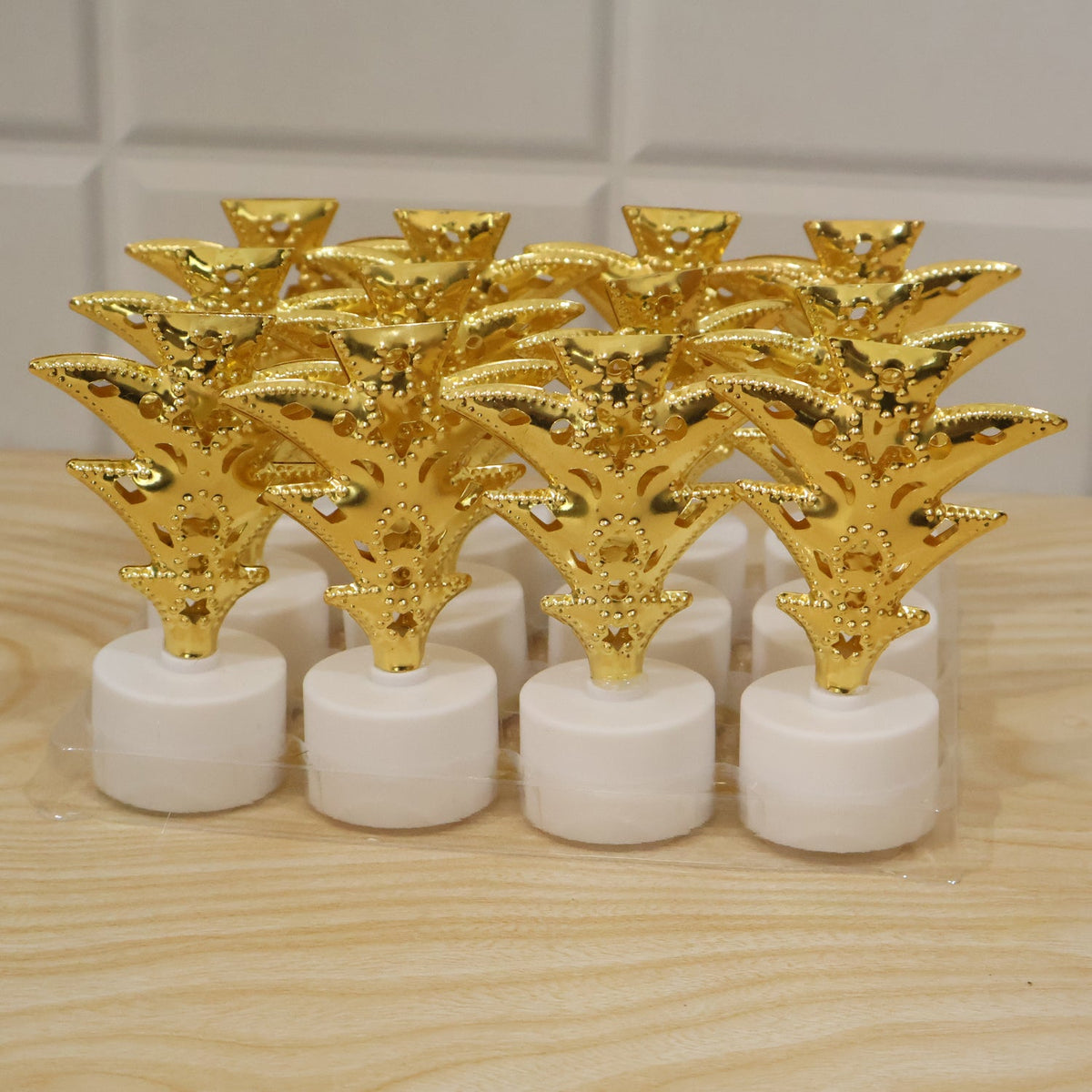 Set of 12 golden Christmas tree LED tealight candles by Wukusy, ideal for home and festive holiday decor.