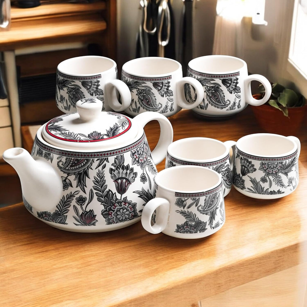 Handcrafted ceramic Stylo Black teapot and cup set for home and kitchen, featuring elegant black design and matching cups.
