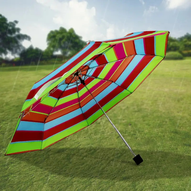 Ekom 3-fold sun and rain protective solid foldable umbrella, garden accessory, with mixed design, portable and durable.