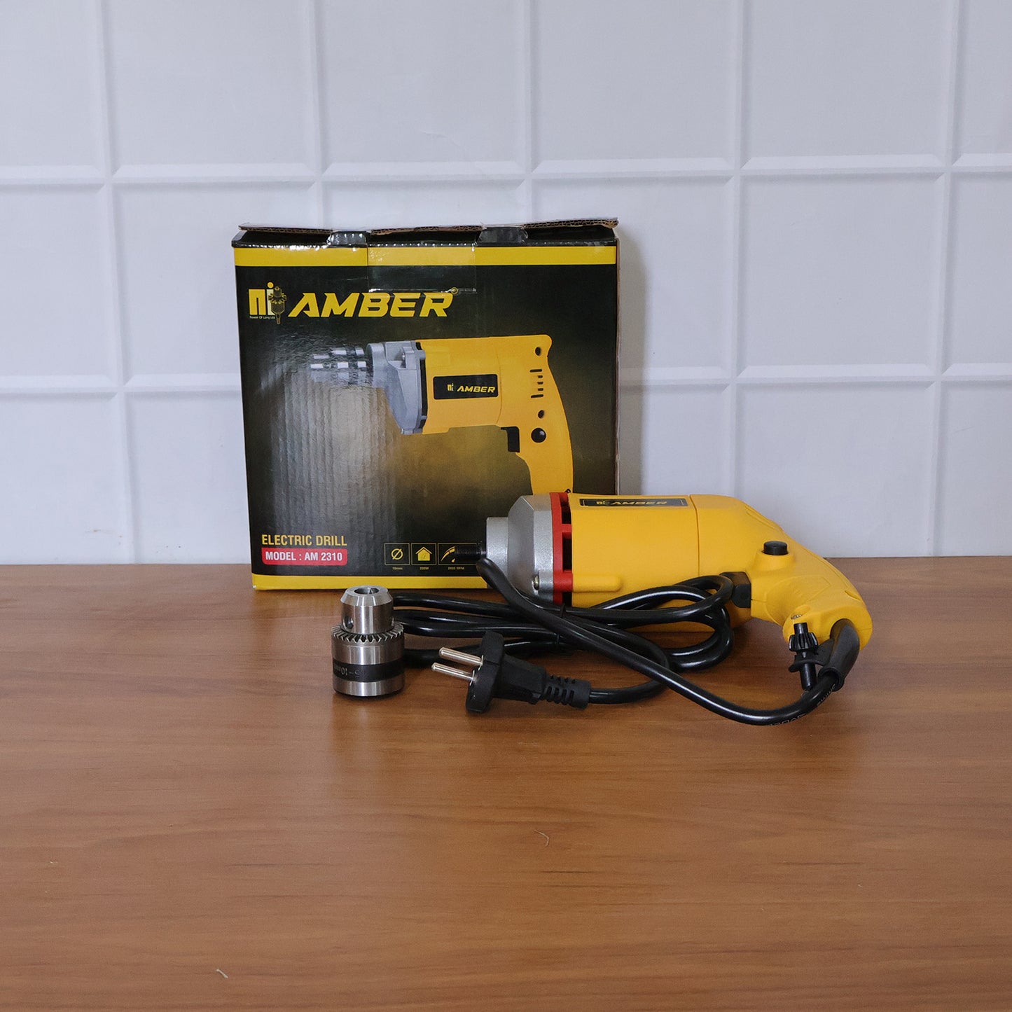 Amber Electric Drill Am2310 by Wukusy, 350W power, showing a close-up of the black and yellow handheld power drill.