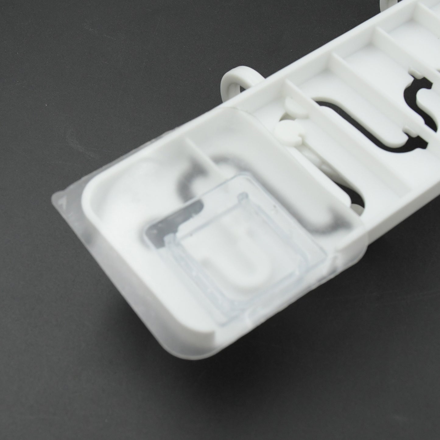 Wukusy 9431 slideway adjustable plastic wall hook with adhesive, ideal for bathroom and home organization.