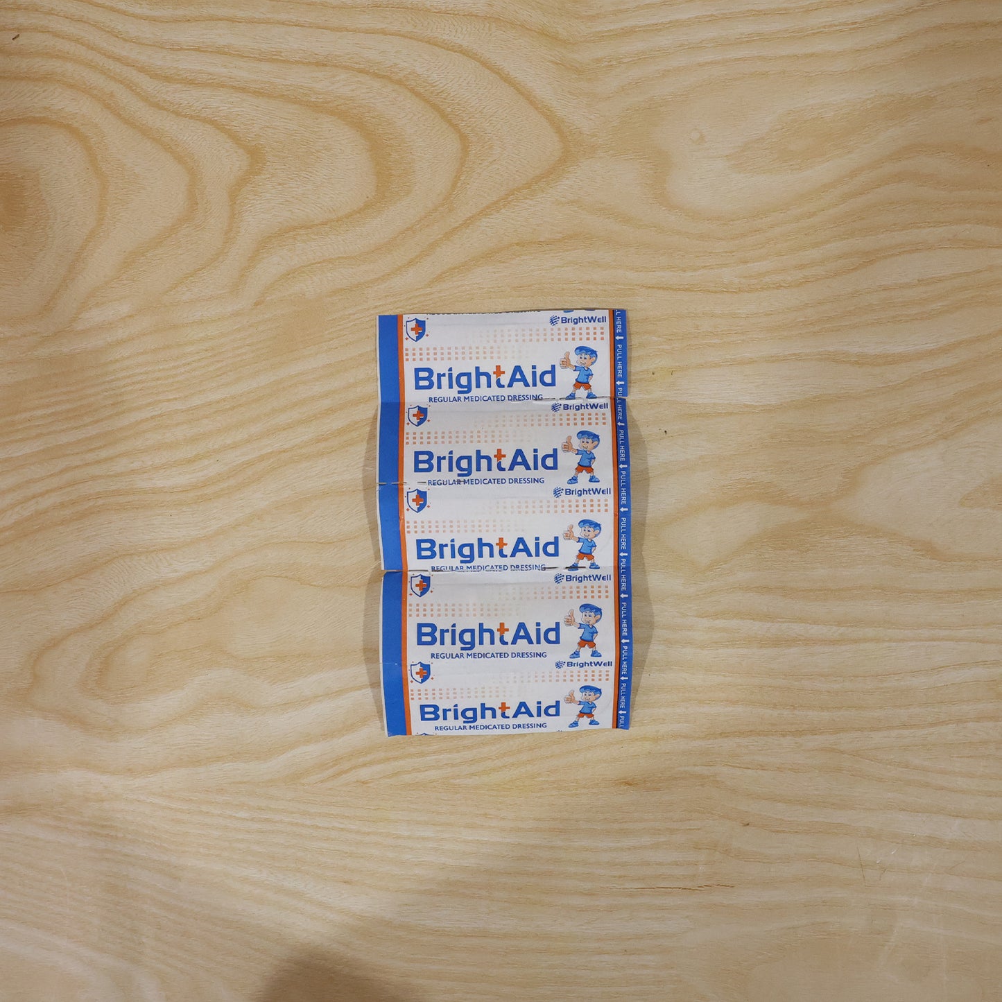 Wukusy Brightaid regular adhesive bandages for cuts and wounds, five pack of first aid strips on a white background.