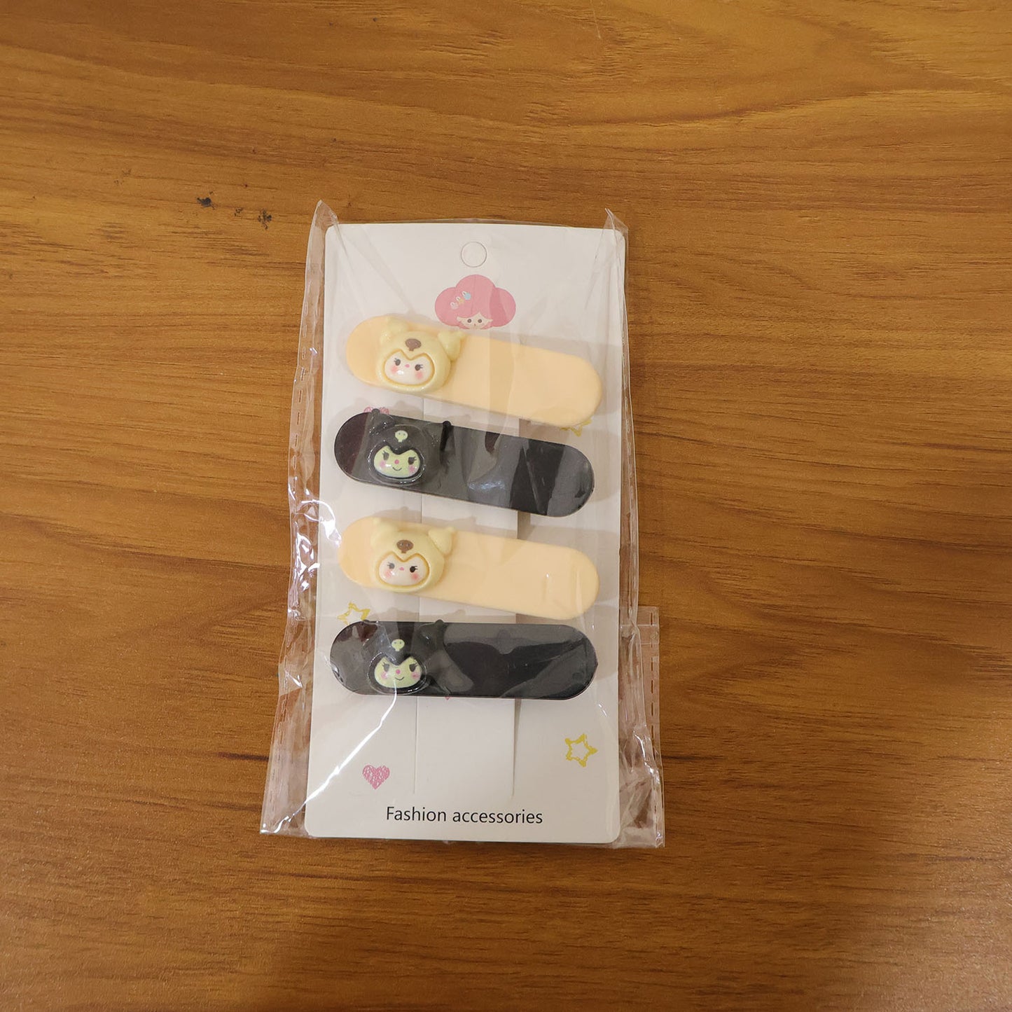 Set of four cute cartoon character decorative hair clips by Wukusy, featuring colorful, playful designs for kids' hair accessories.